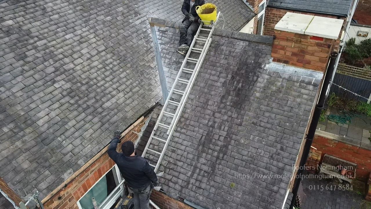 a picture of roofers Nottingham carrying out a valley repair on a pitched roof