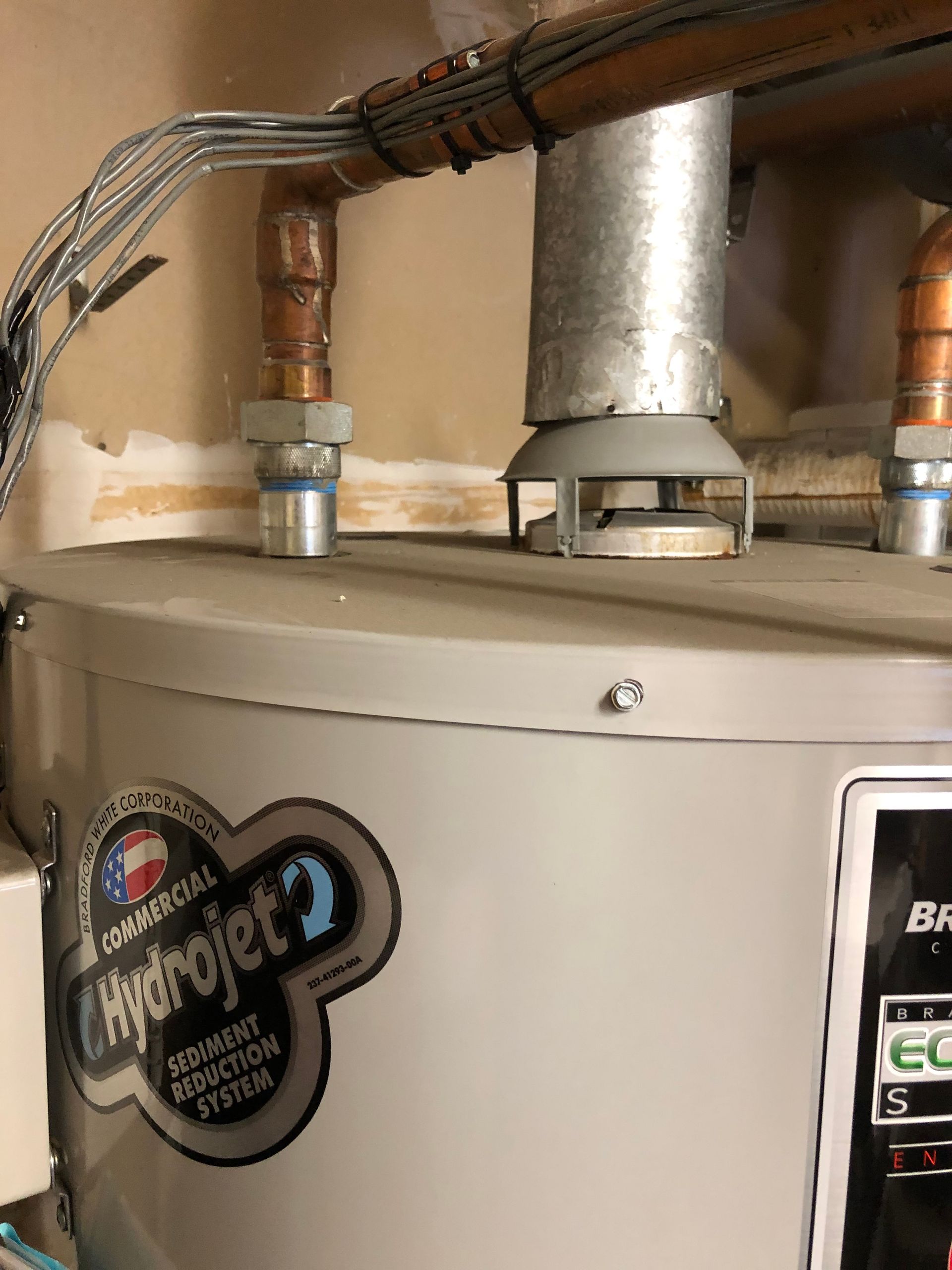 A white water heater with the word hydrojet on it