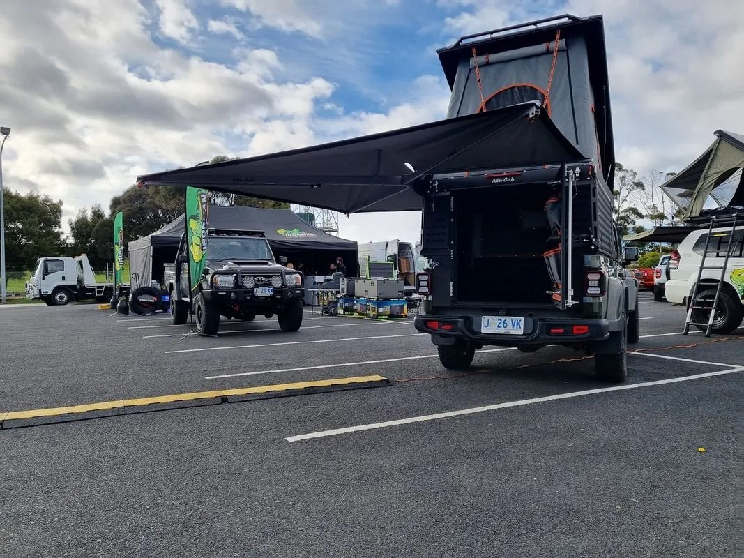 Black Truck With Raised Canopy Parked on a Road — Kingston 4wd and Tyres In Huntingfield, TAS