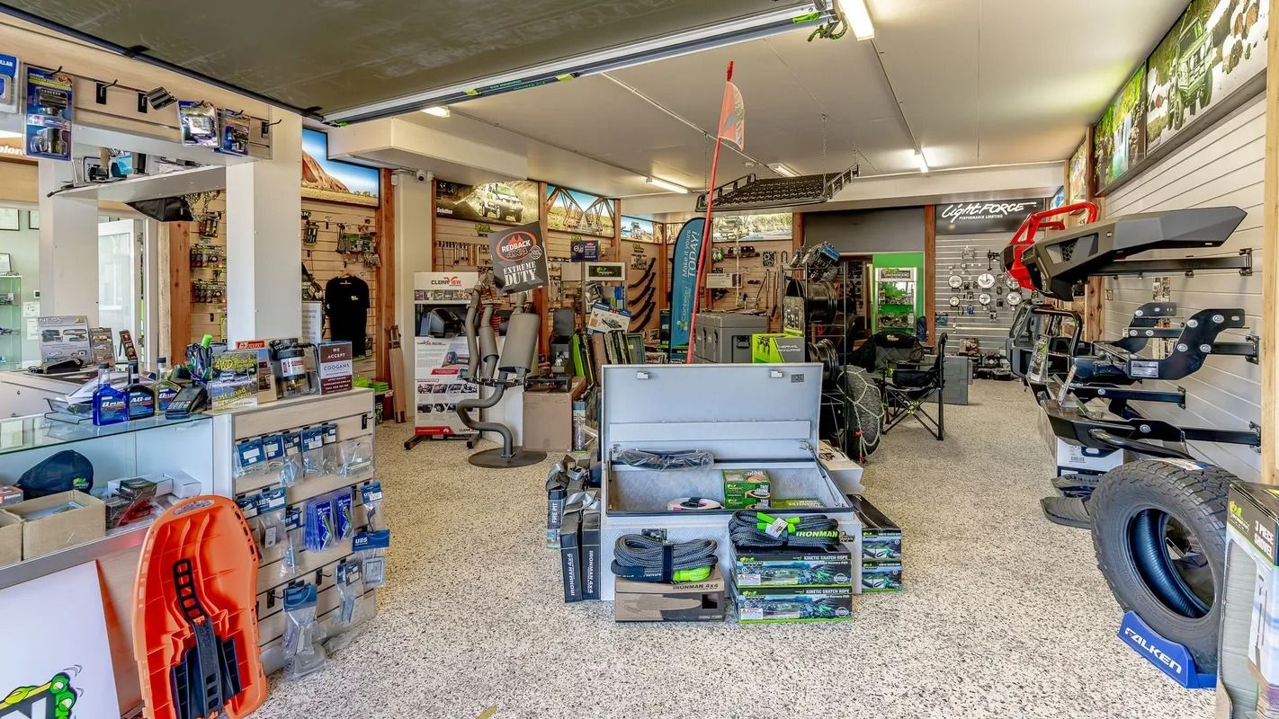 Cluttered Auto Parts Shop Interior With Shelves, Tires, Tools, and Boxed Products — Kingston 4wd and Tyres In Huntingfield, TAS