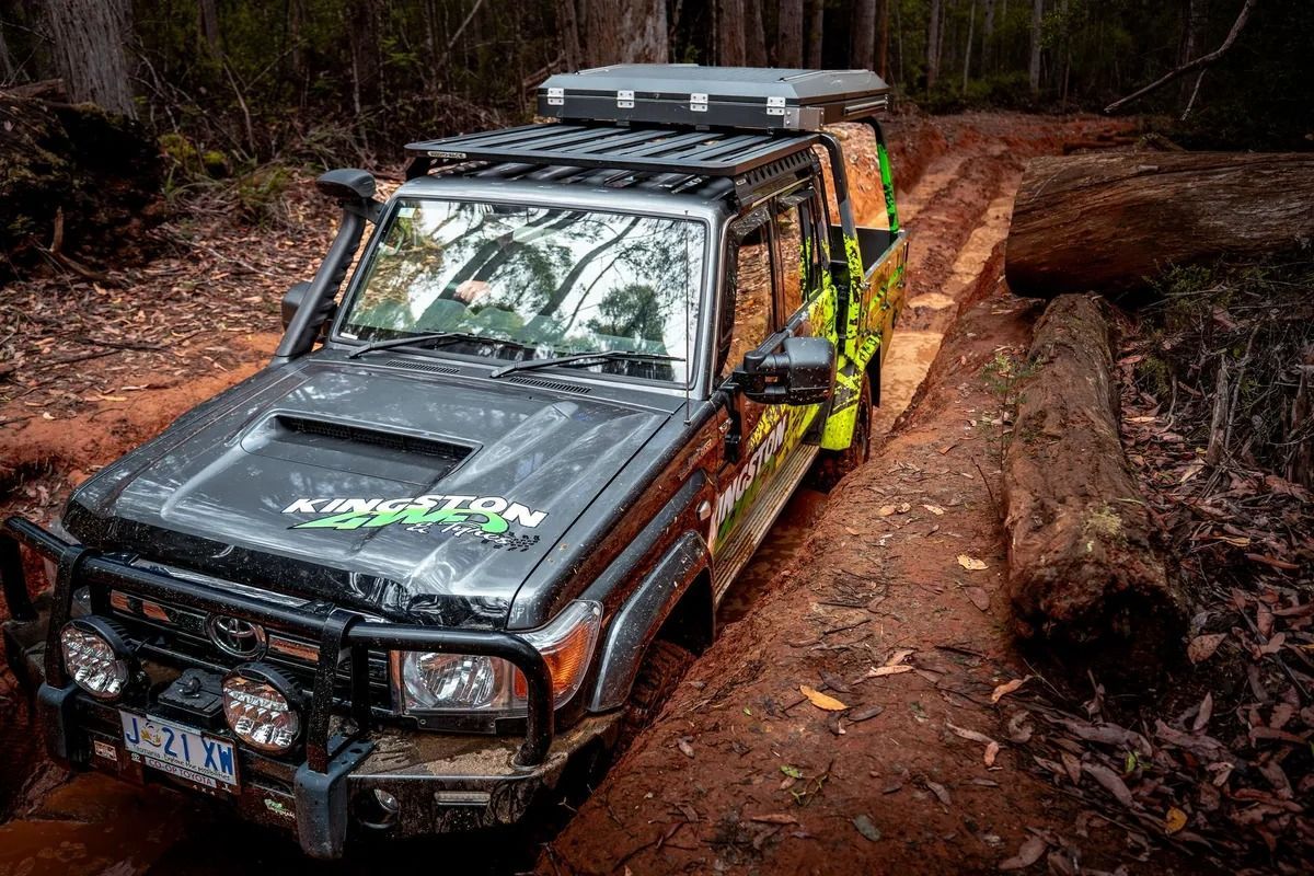 Off-road SUV With Roof Rack Navigating a Muddy Forest Trail — Kingston 4wd and Tyres In Huntingfield, TAS
