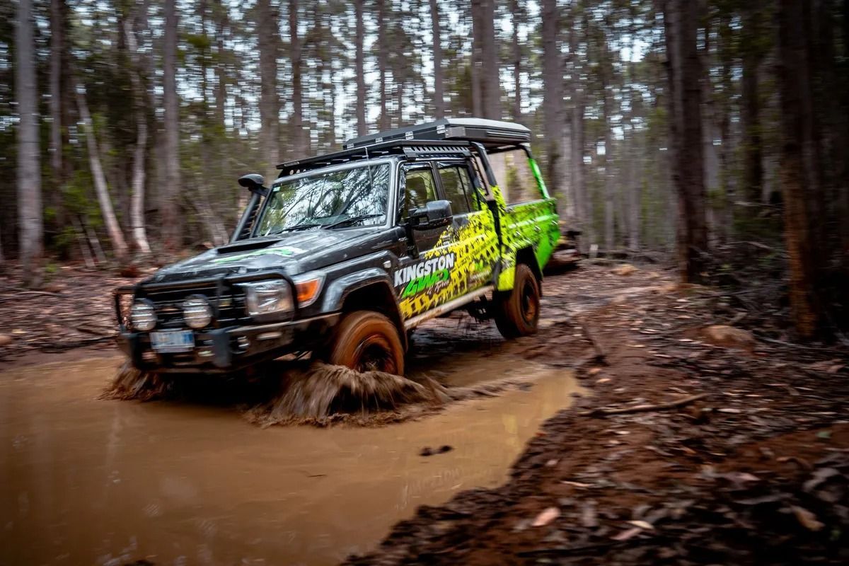 Off-road SUV Splashing Through a Muddy Forest Trail — Kingston 4wd and Tyres In Huntingfield, TAS