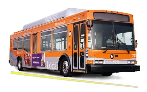 A metro bus is sitting on a white surface.
