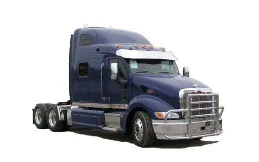 A blue semi truck is parked on a white background.