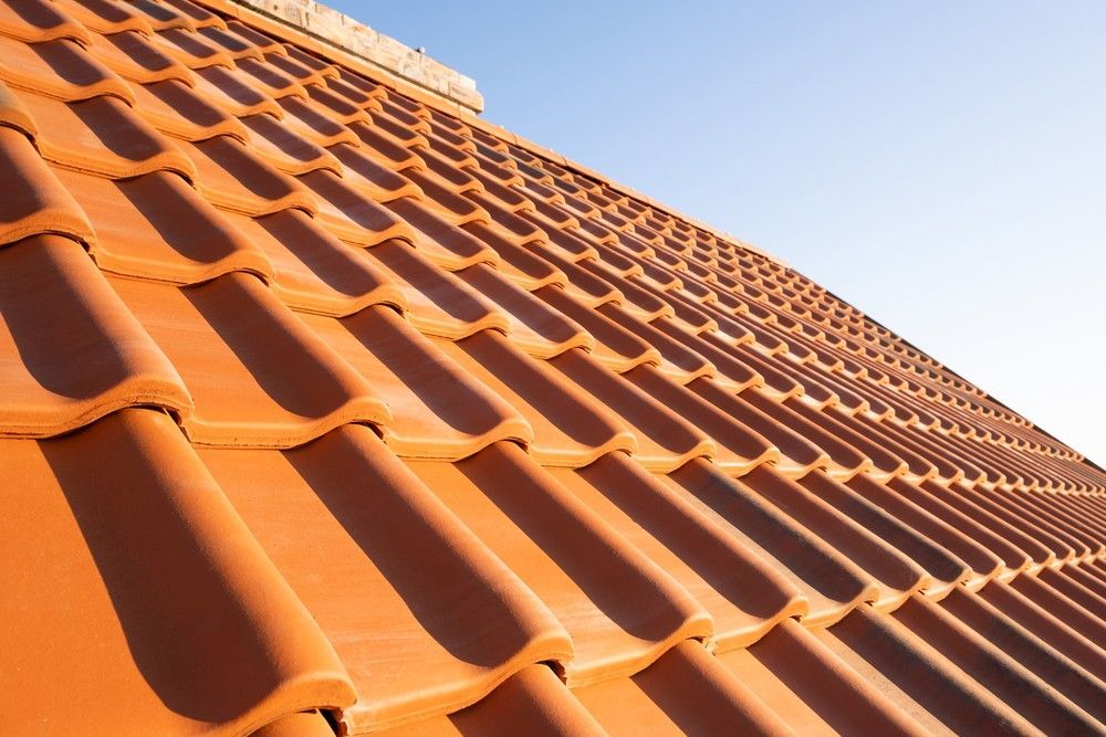 A Close Up of a Tiled Roof With a Blue Sky in the Background — Roofpoint In Maryborough, QLD