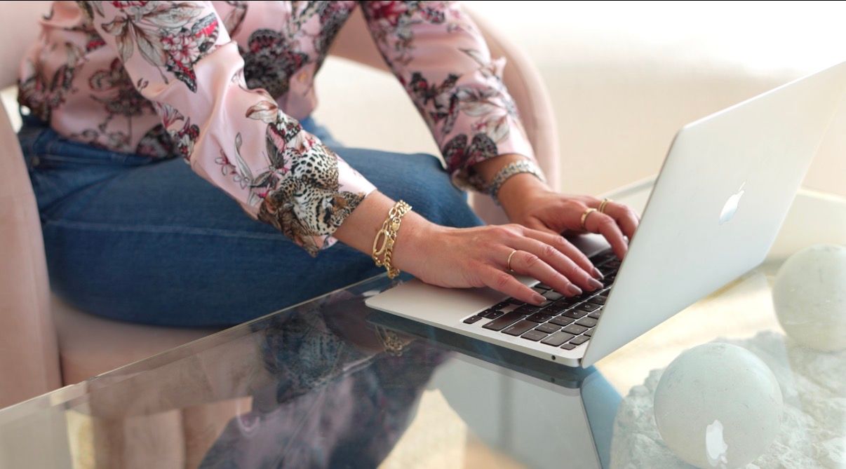 Professional woman reviewing financial documents in a sunlit South Bay office.
