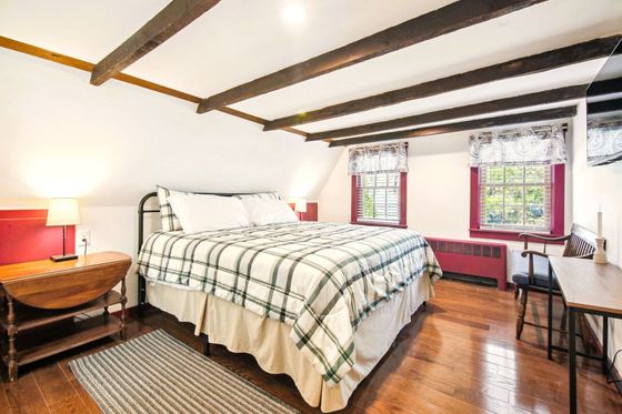 Rustic charm and elegance with a plush king-size bed.
