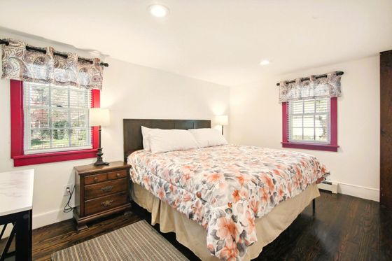 Serene first-floor retreat  featuring a luxurious king-size bed
