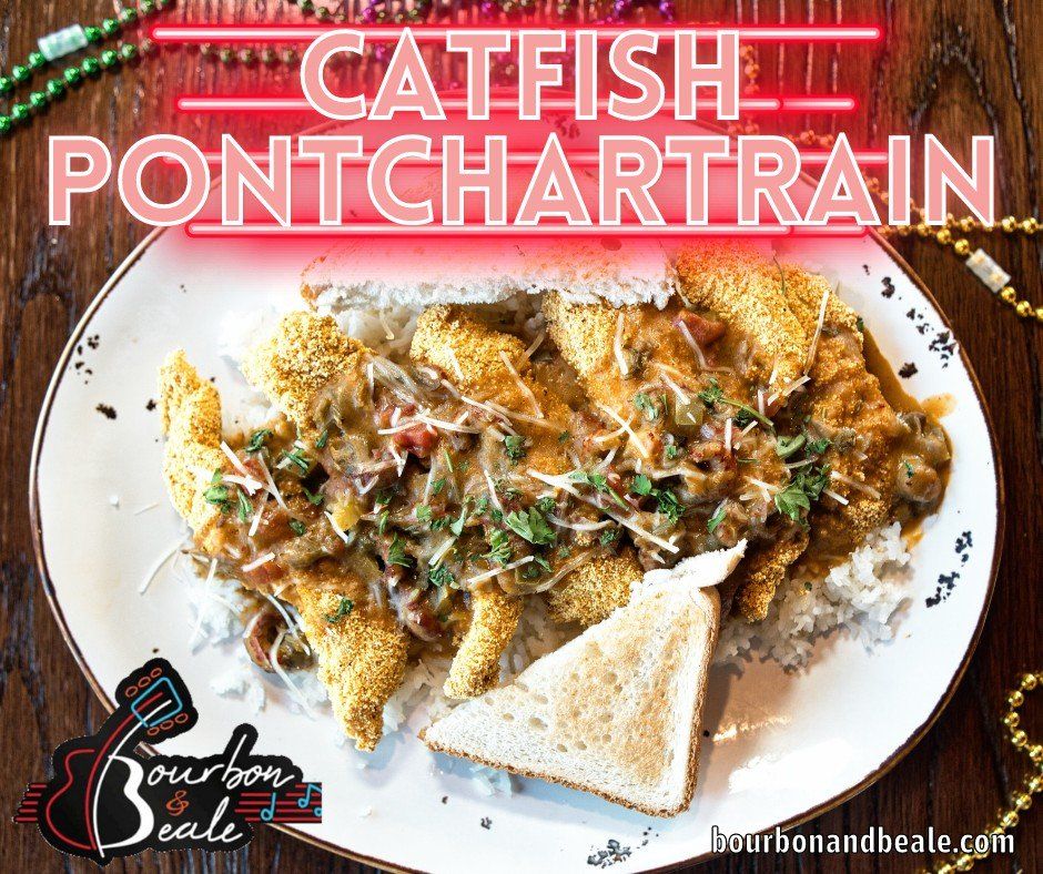 Catfish Pontchartrain on a white plate, topped with sauce and herbs, with toast on the side.