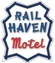 Rail Haven Motel logo in blue and red with a starburst background