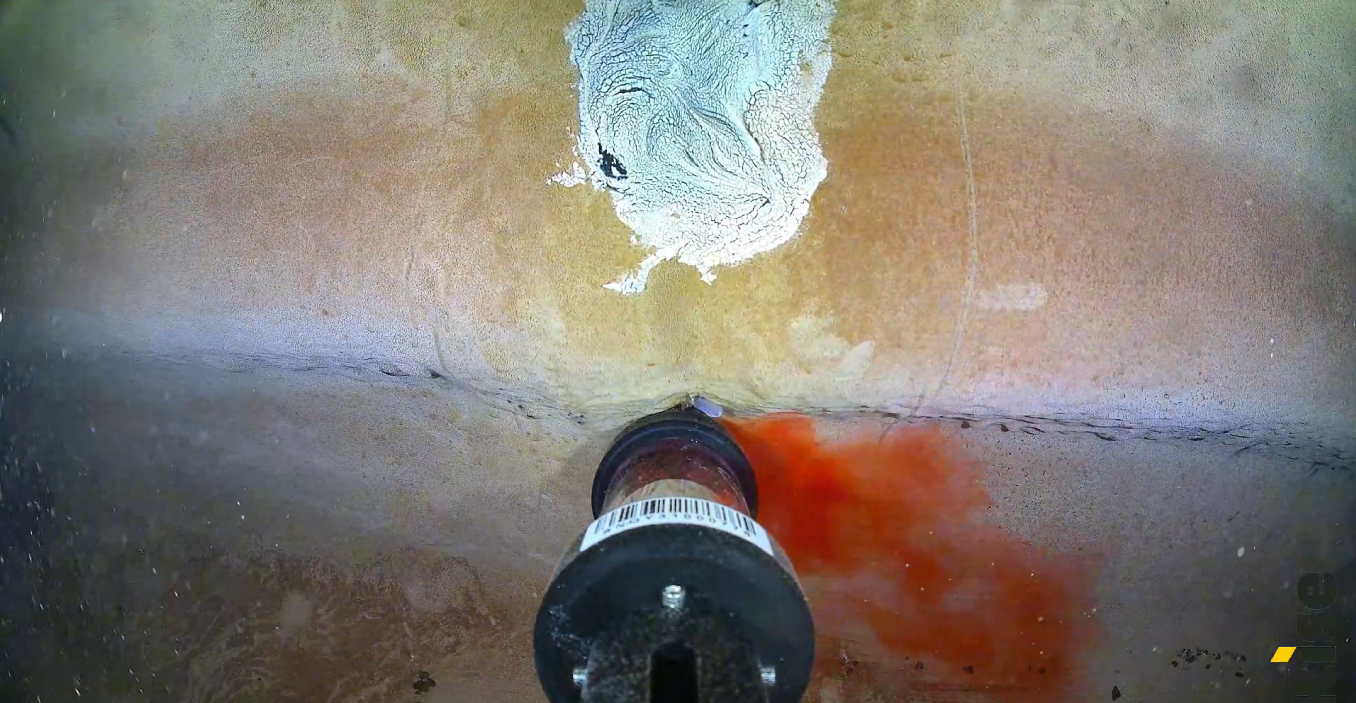 Underwater ROV deploying dye in large water tank to check for leaks in Northern Territory.