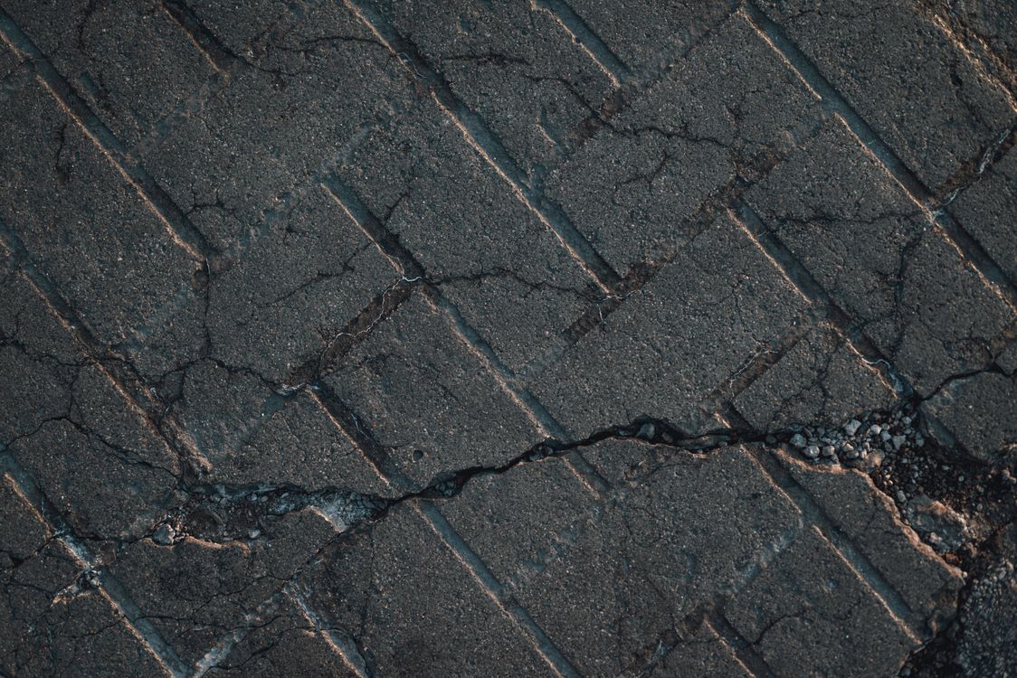 Close-up of cracked and weathered paving stones