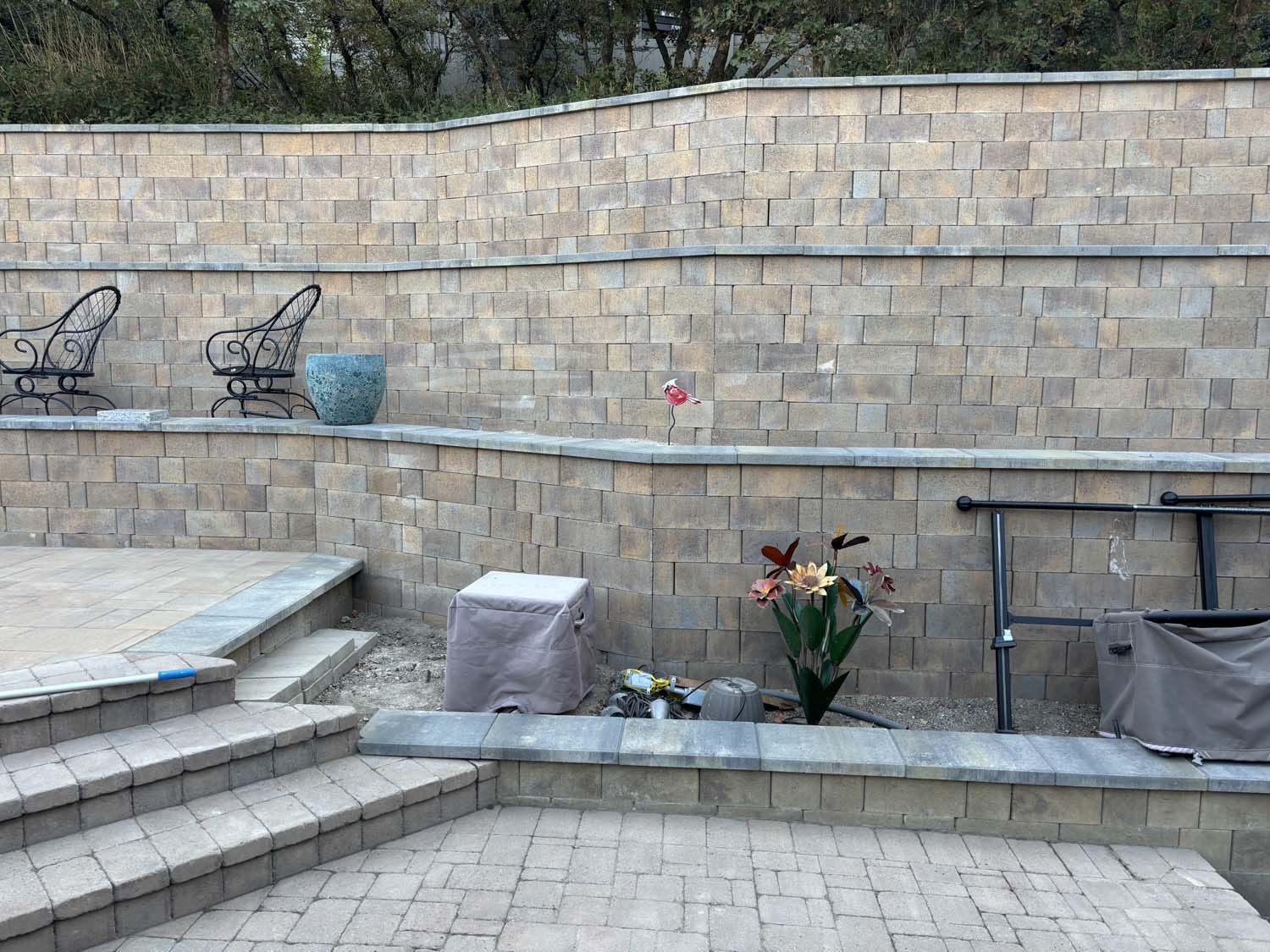 A brick wall with stairs leading up to it