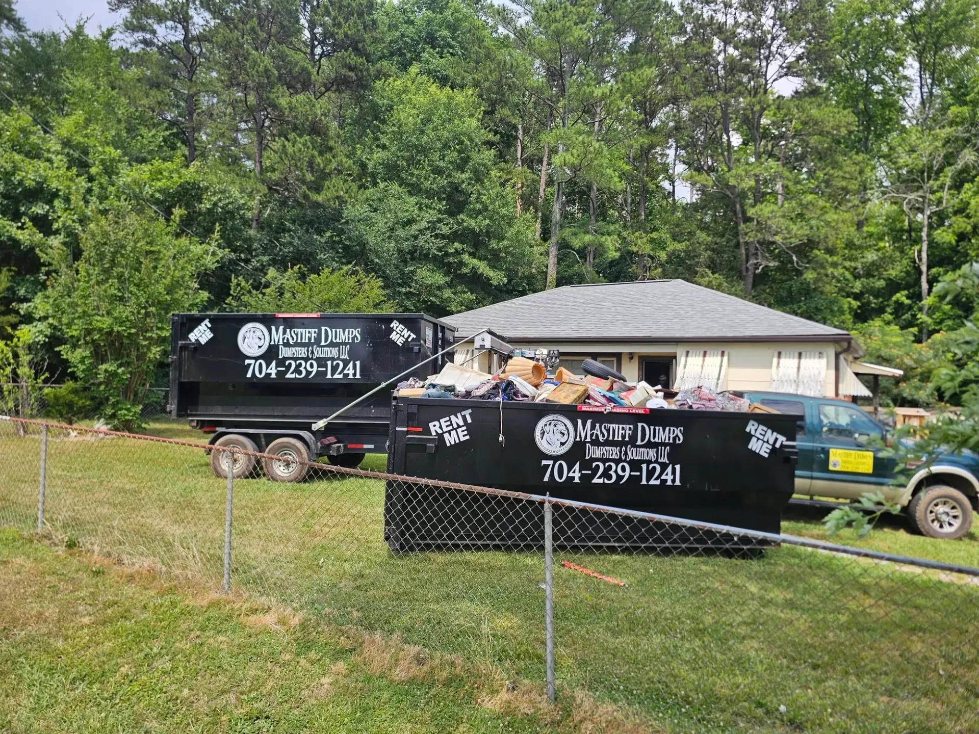A dumpster that says rent me on it
