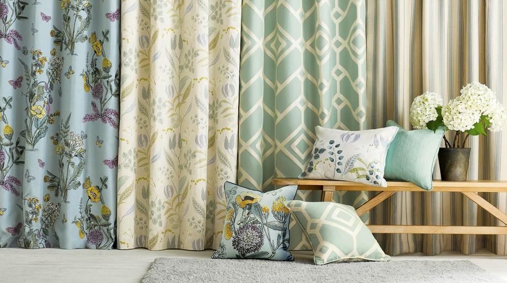 There Are Many Different Types of Curtains and Pillows in This Room — Mid Coast Flooring & Blinds In Taree, NSW