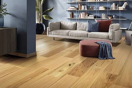 Two Pieces Of Wood Are Stacked On Top Of Each Other On A Wooden Floor — Mid Coast Flooring & Blinds In Forster, NSW