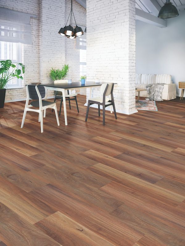 A Dining Room With A Wooden Floor And A Table And Chairs — Mid Coast Flooring & Blinds In Taree, NSW