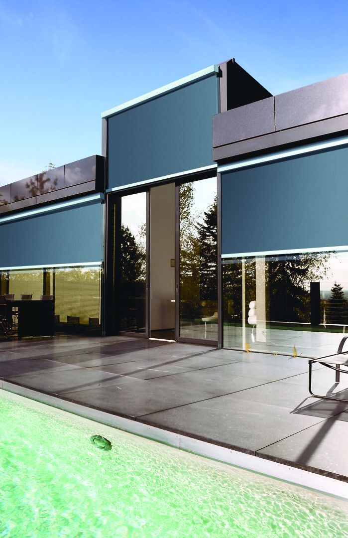 A Yellow Awning Is Sitting On The Side Of A Building — Mid Coast Flooring & Blinds In Wingham, NSW