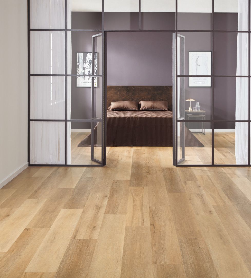 There Is A Bed In The Middle Of The Room With A Drawer Underneath It — Mid Coast Flooring & Blinds In Taree, NSW