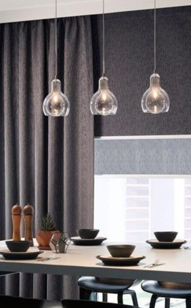 A Window With Yellow Curtains And A View Of The City — Mid Coast Flooring & Blinds In Old Bar, NSW