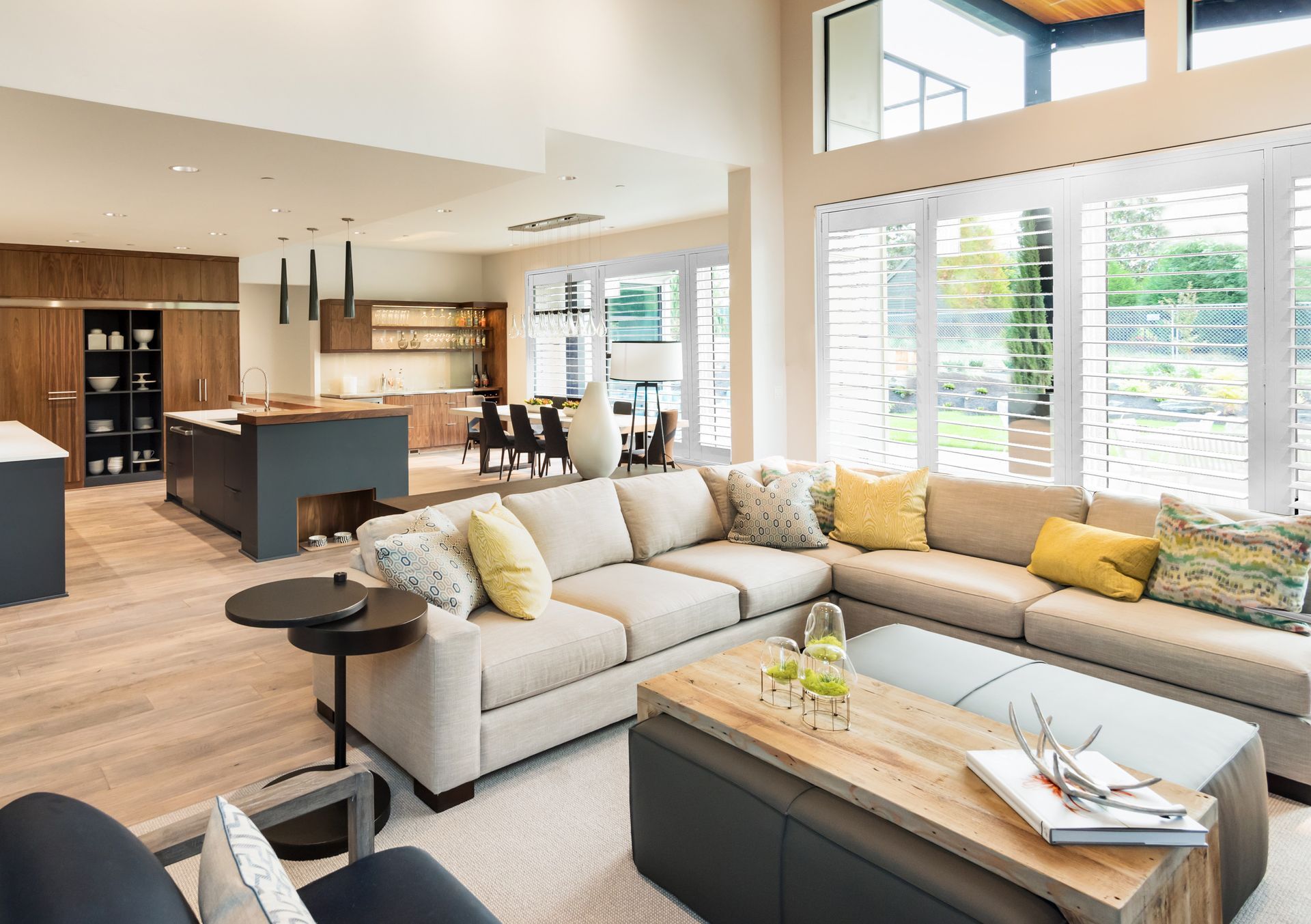 A Large Empty Room With A Counter In The Middle And A Lot Of Windows — Mid Coast Flooring & Blinds In Taree, NSW