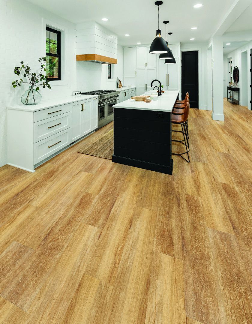 A Wooden Floor Is Being Installed In A Room — Mid Coast Flooring & Blinds In Wingham, NSW