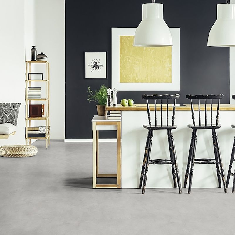 A Kitchen With A Table And Chairs And A Black Wall — Mid Coast Flooring & Blinds In Taree, NSW