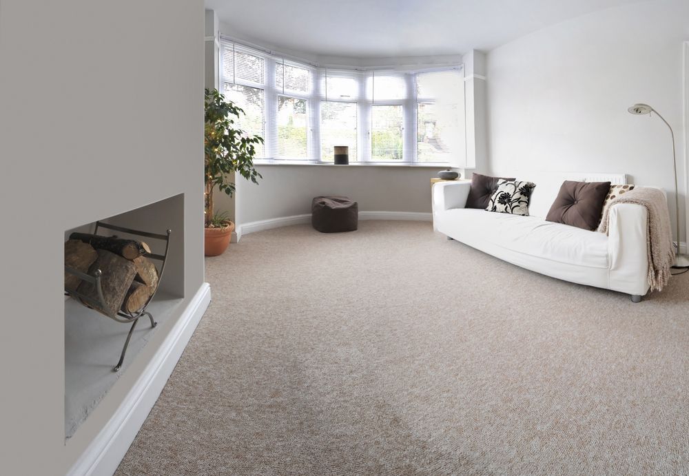 A Living Room With A White Couch And A Fireplace — Mid Coast Flooring & Blinds In Wingham, NSW