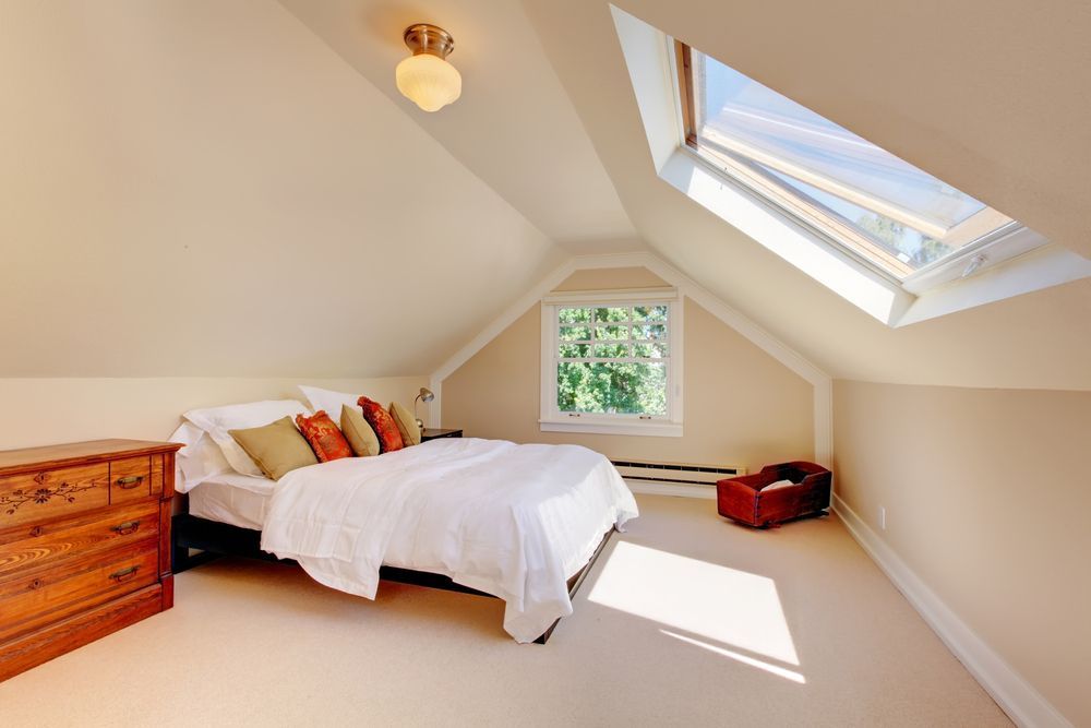 A Bedroom With A Bed — Mid Coast Flooring & Blinds In Forster, NSW