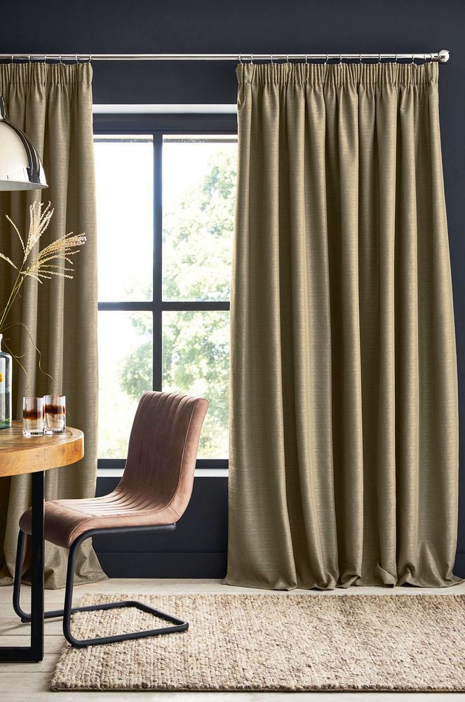 A Living Room With Curtains, a Chair, a Table and a Window — Mid Coast Flooring & Blinds In Taree, NSW