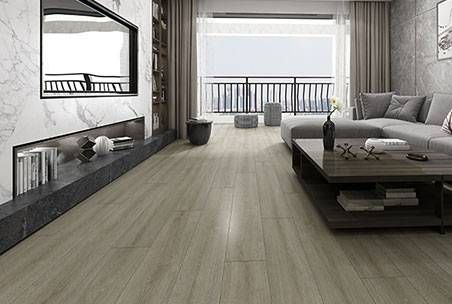 A Hammer Is Laying On A Wooden Floor — Mid Coast Flooring & Blinds In Taree, NSW