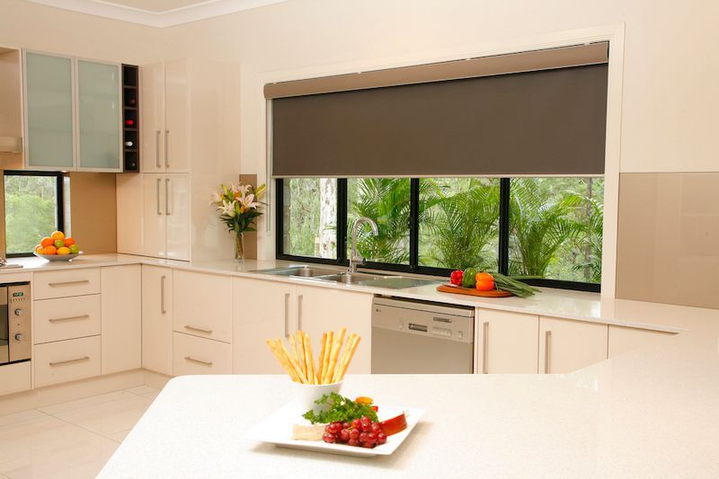 A Kitchen With A Large Window And A Plate Of Food On The Counter — Mid Coast Flooring & Blinds In Old Bar, NSW
