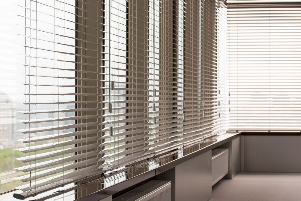 A Room With a Lot of Windows and Blinds on Them — Mid Coast Flooring & Blinds In Taree, NSW