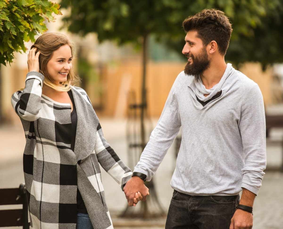 couple holding hands of each other