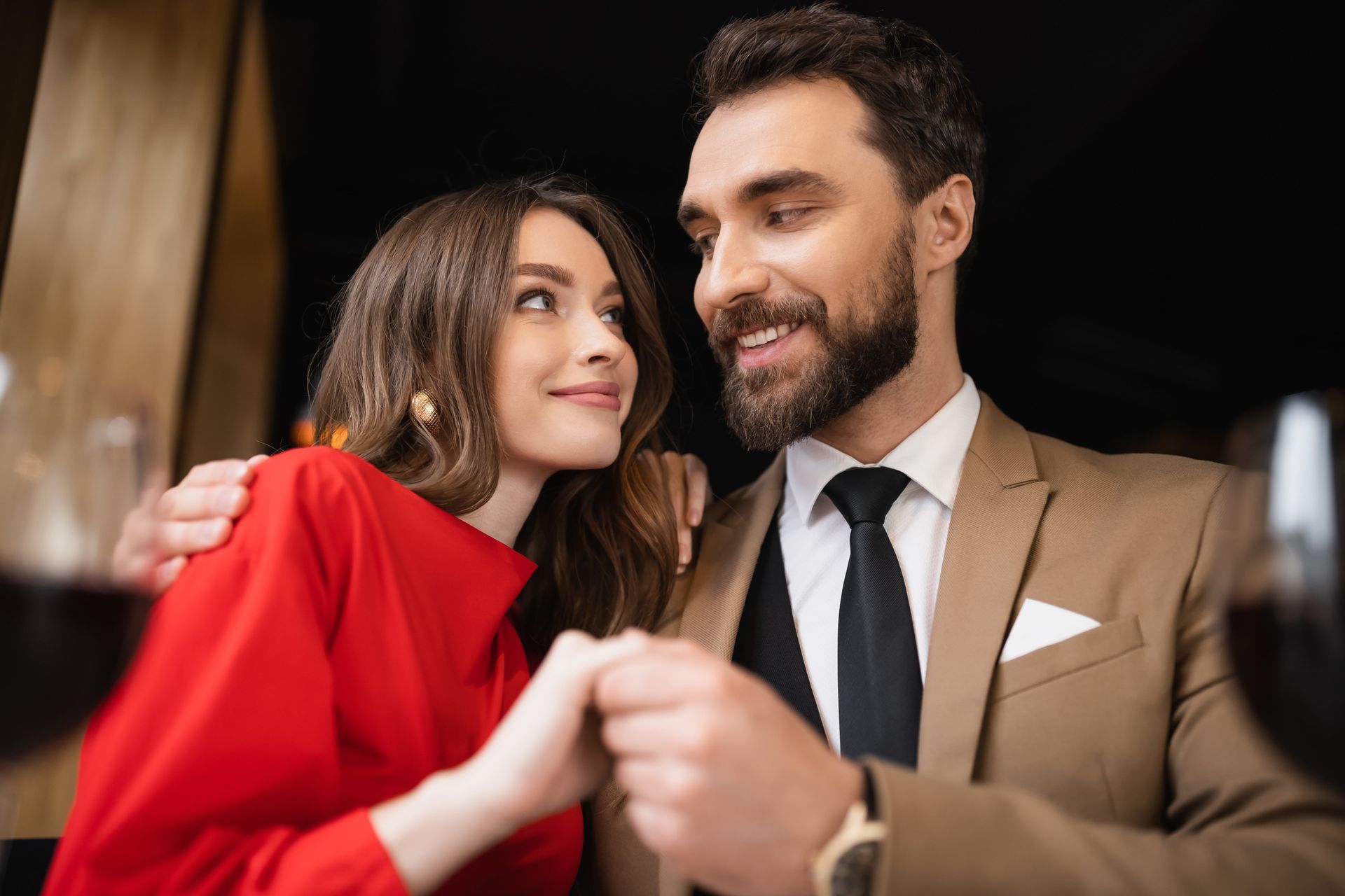 Couple in embrace looking at each other representing emotional intimacy and availability