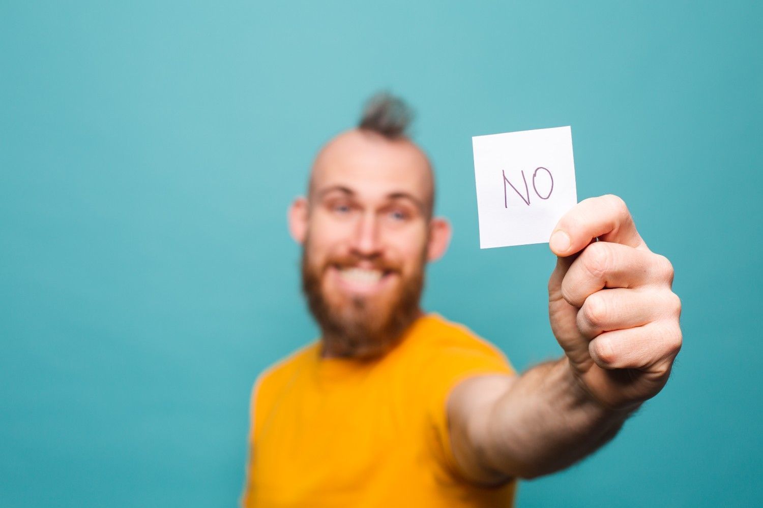 man holding a paper shows no written on it