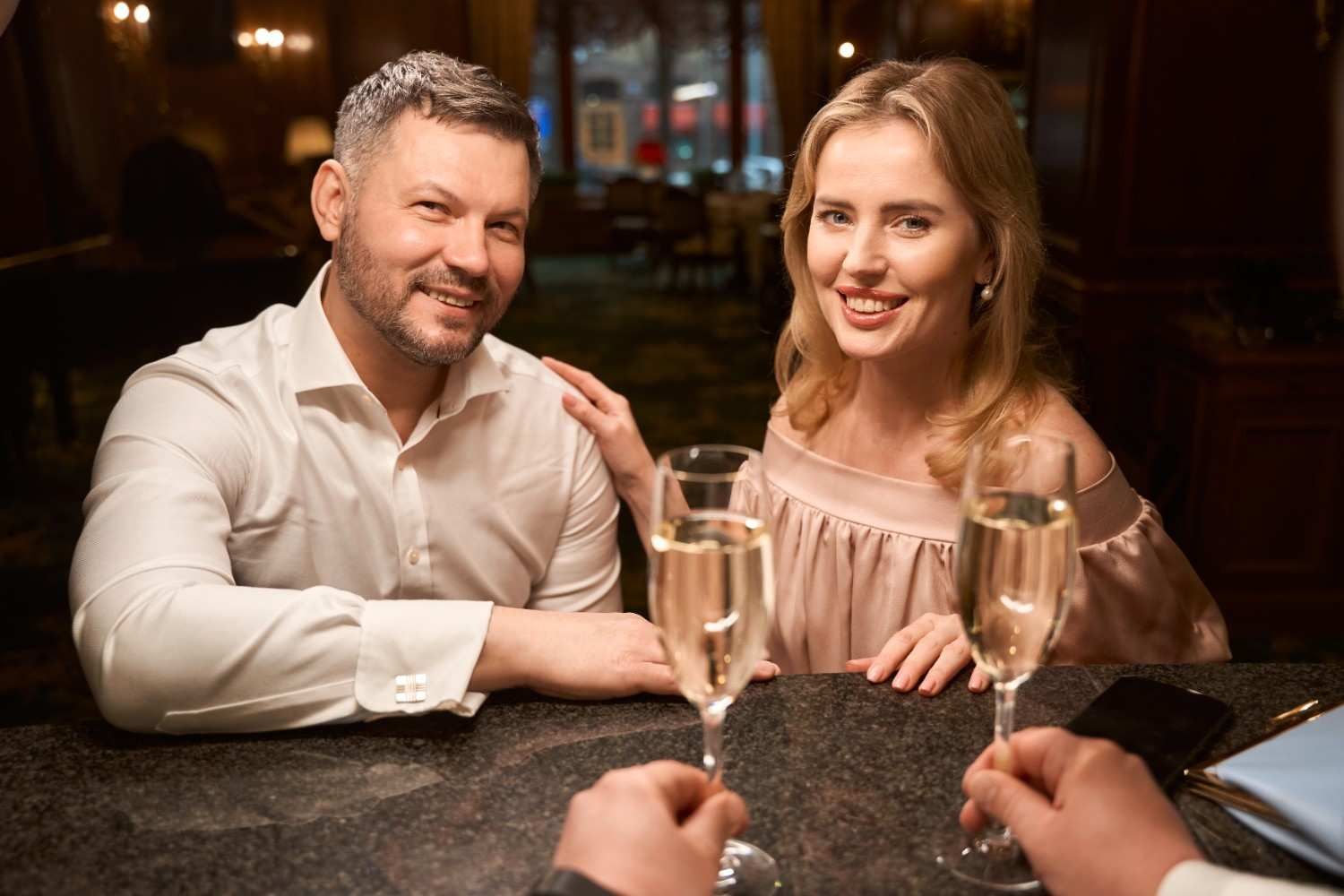 Couple at date smiling representing positive connection in Houston dating scene
