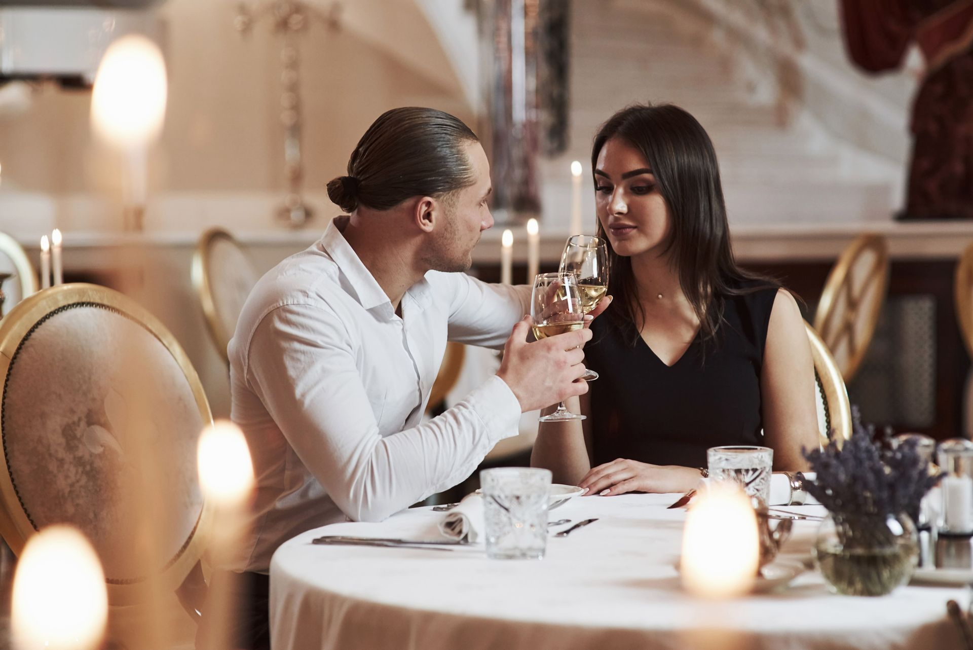Couple at candlelit dinner representing attraction, emotional connection, and romantic chemistry