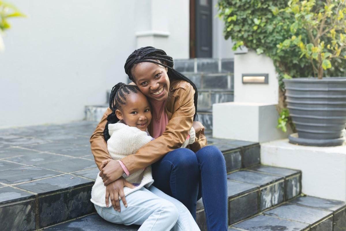 Mother hugging child showing emotional connection and single parent family love