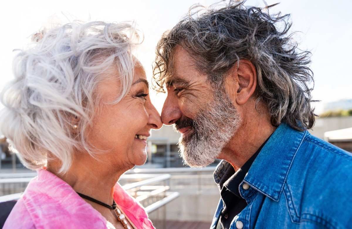 old couples seing closely touching their nose