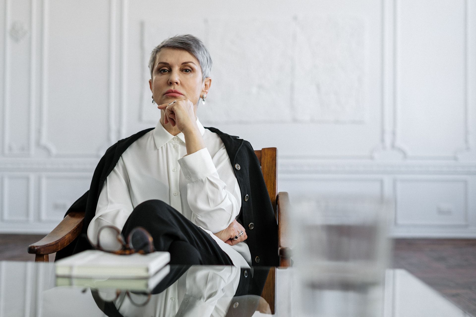 Professional woman reflecting on dating after divorce, confident and composed in modern Houston