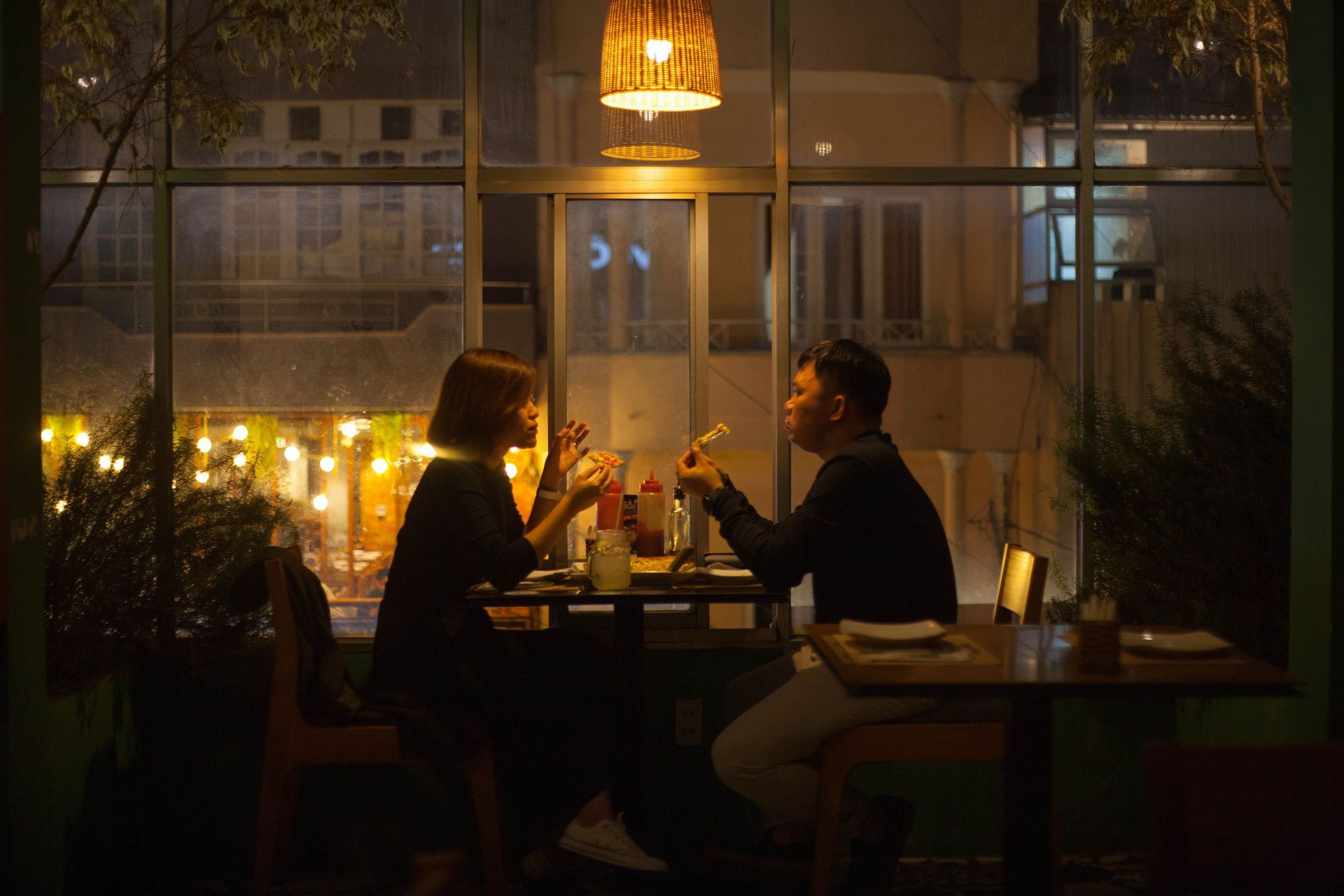 Elegant couple enjoying an intimate dining experience, representing the luxury matchmaking service