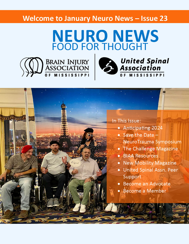 A group of people in wheelchairs are sitting under a tent.
