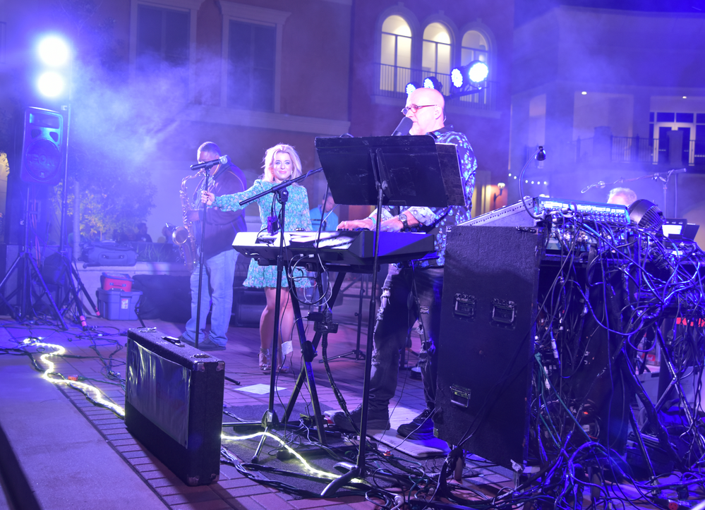 A group of people are playing instruments on a stage.