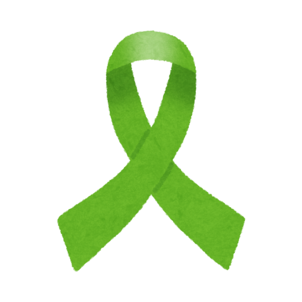 A green ribbon is crossed over itself on a white background