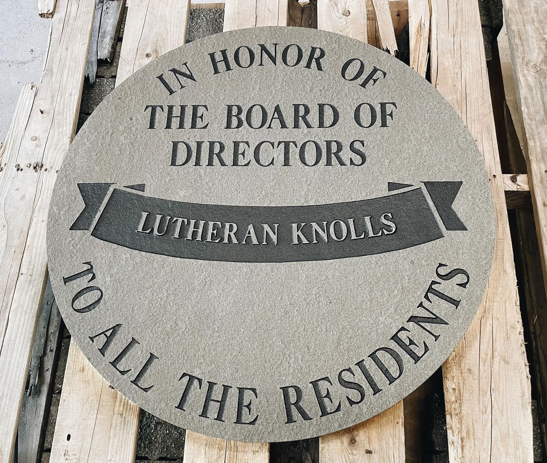 A sign that says in honor of the board of directors to all the residents