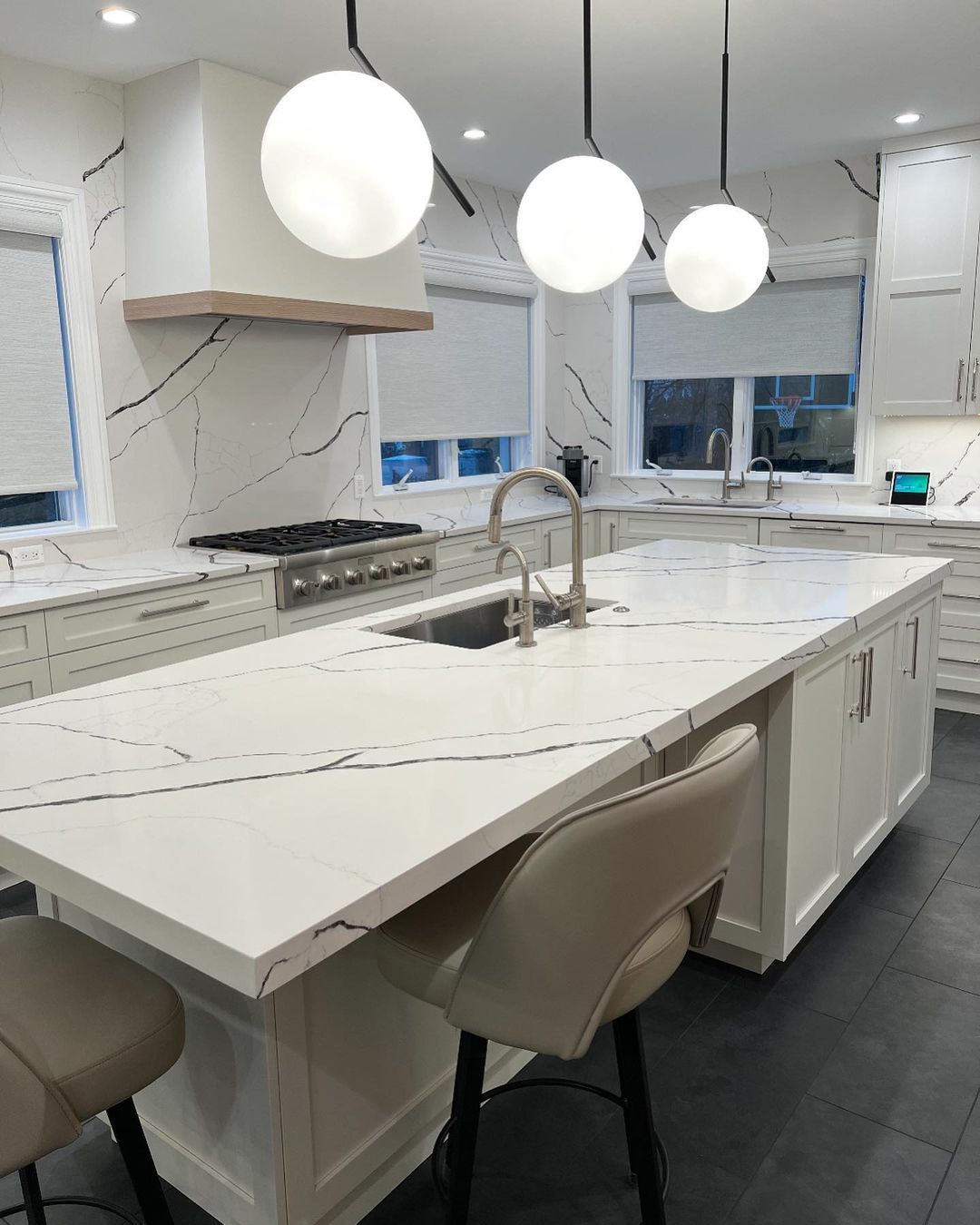 A kitchen with a large island and a sink
