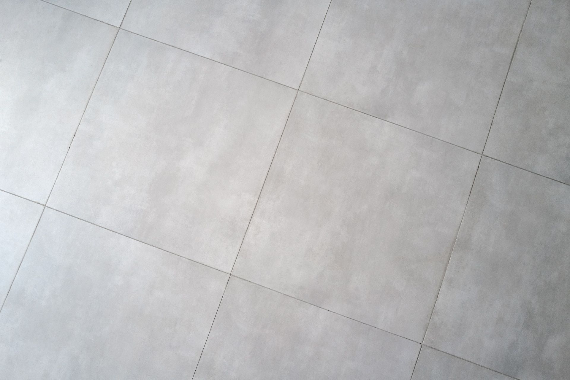 Installation of New Tiles on a Bathroom Floor — Omaha, NE — Lewis Tile Installations Installation of New Tiles on a Bathroom Floor — Omaha, NE — Lewis Tile Installations