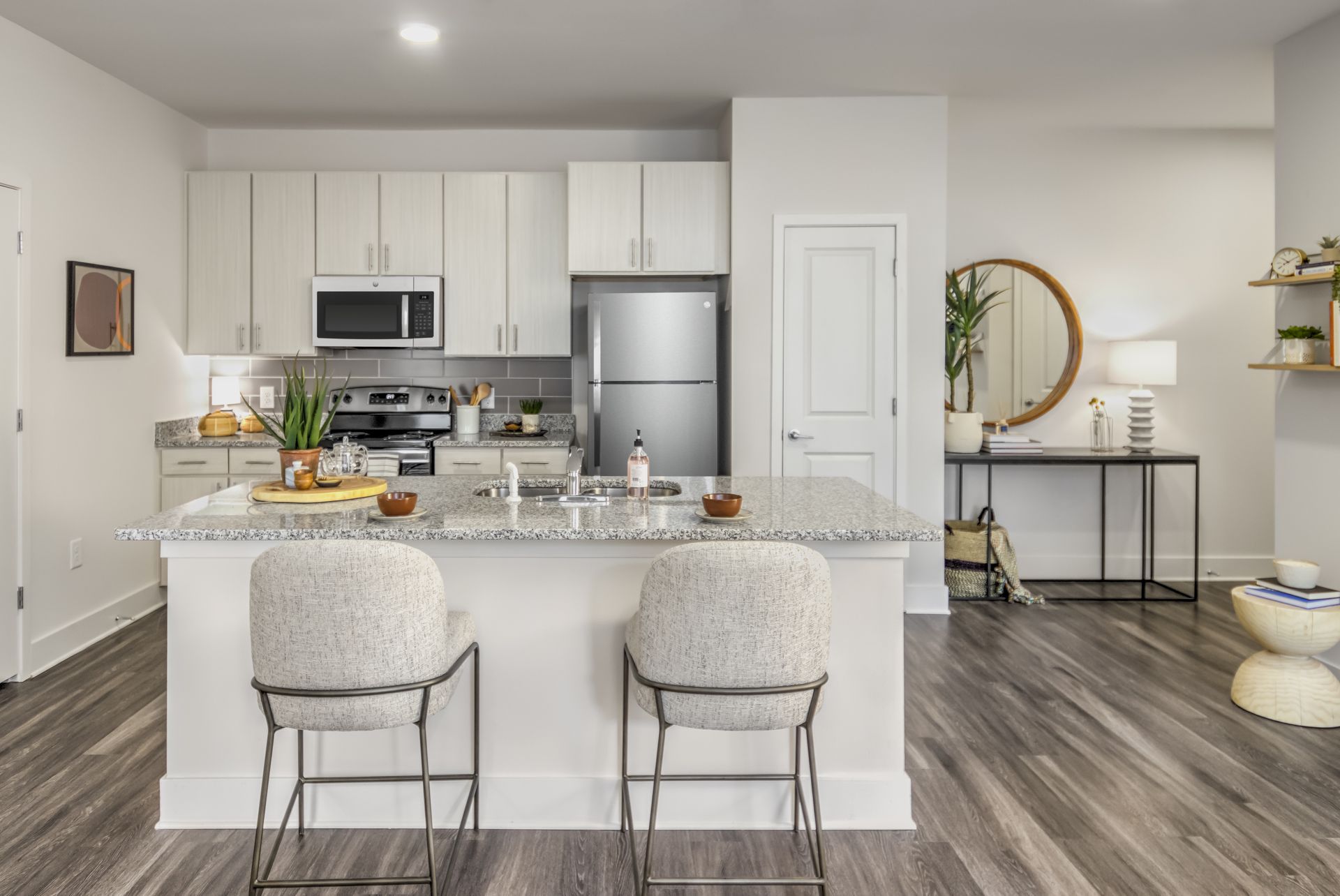 Charlotte apartment kitchen with granite countertops and white cabinets