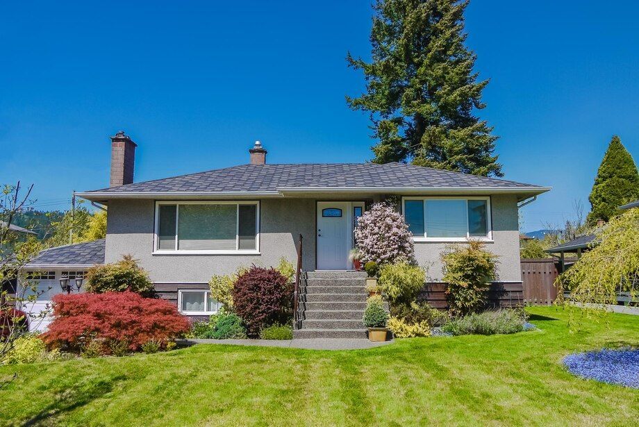 modest-family-house-with-blossoming-flowers